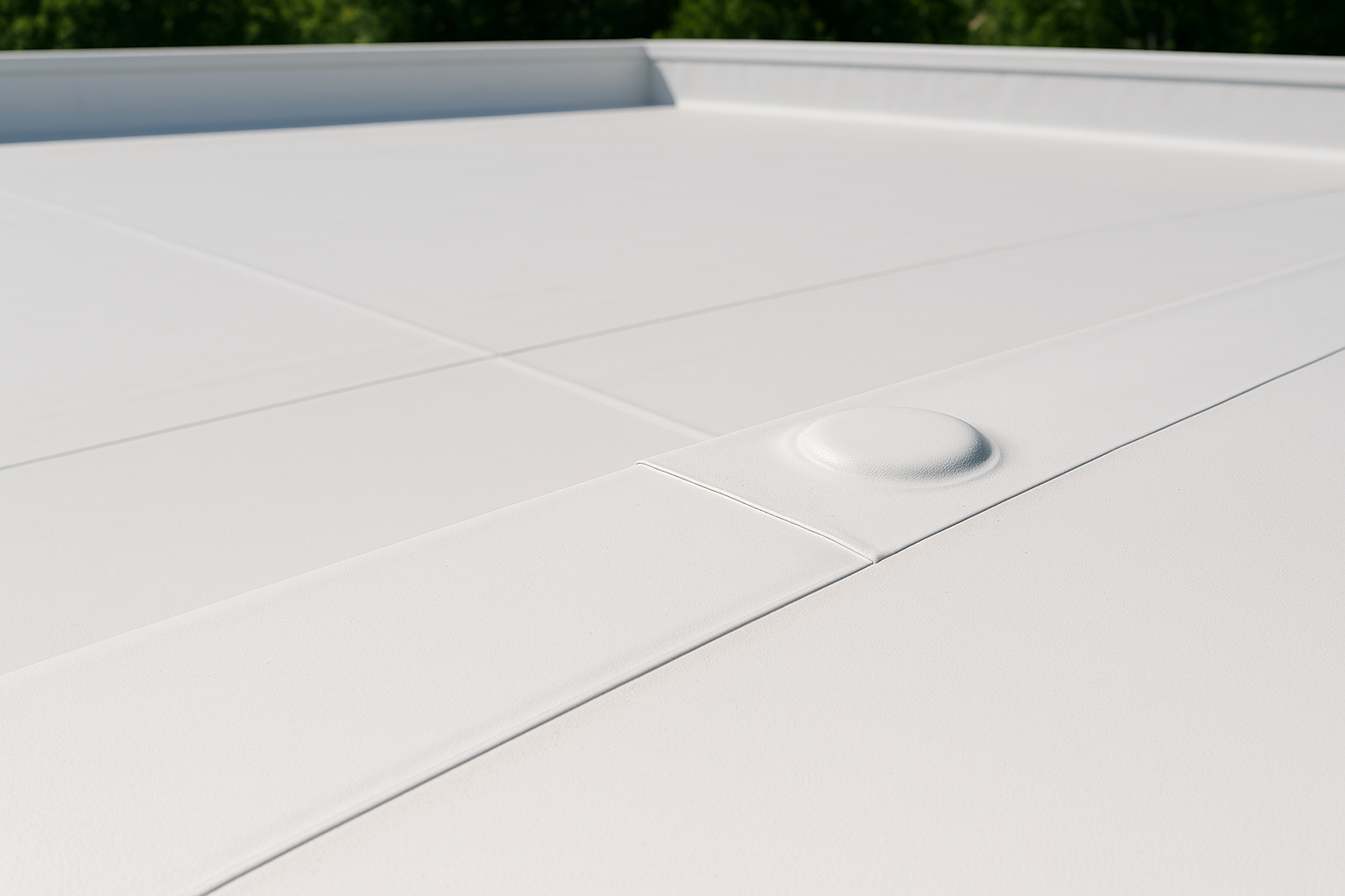Close-up of a flat roof with TPO membrane showing clean, white surface and seamless installation