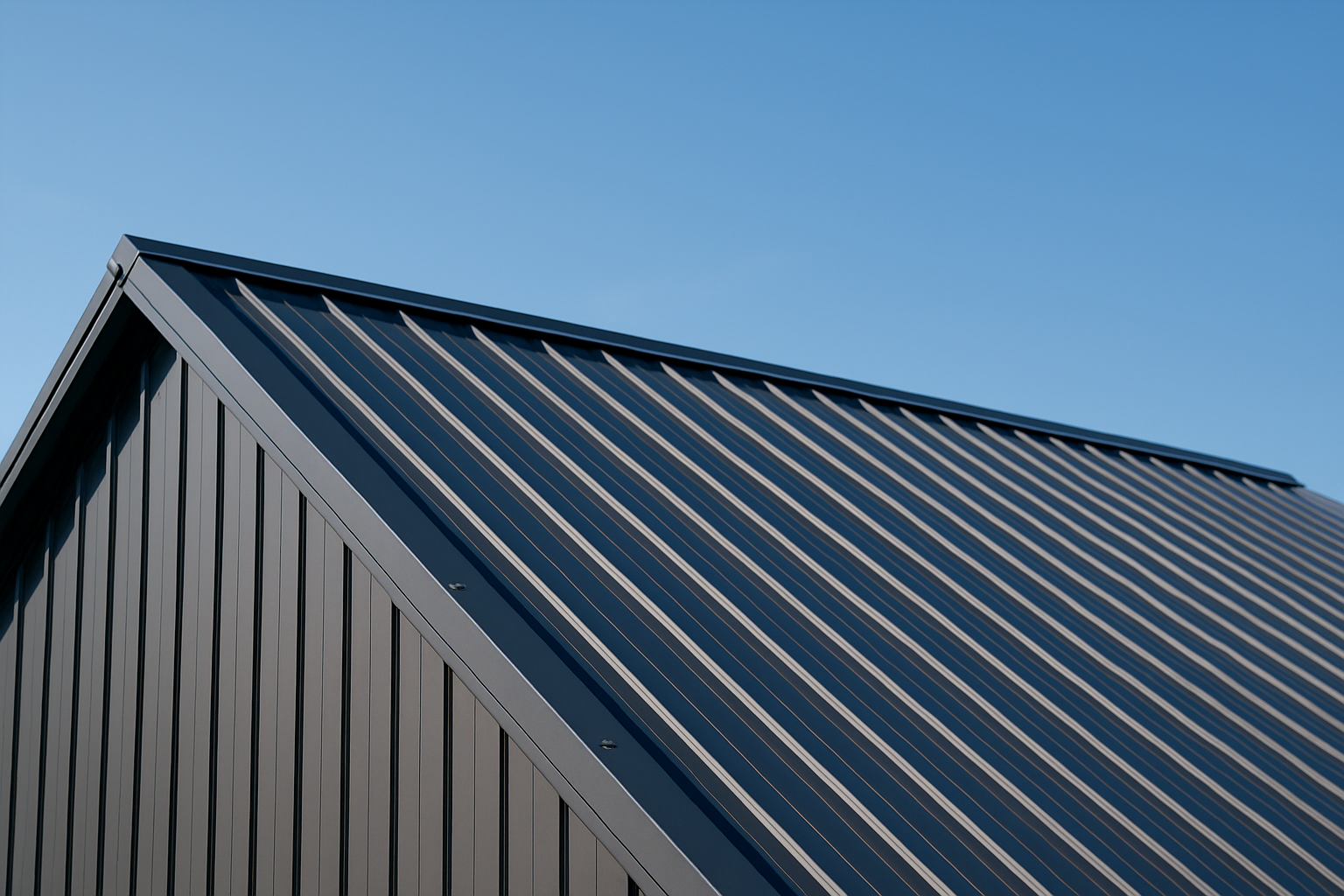 Close-up of a metal roof with visible ridges and a clear blue sky overhead